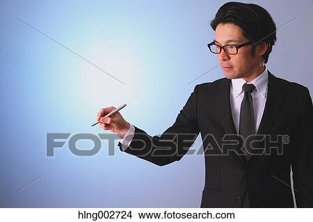 Japanese businessman using virtual reality device View Large Photo Image Picture - Japanese businessman using virtual reality device. Fotosearch