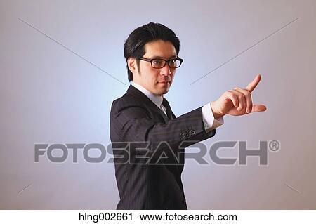 Japanese businessman using virtual reality device View Large Photo Image Stock Image - Japanese businessman using virtual reality device. Fotosearch