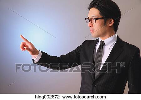 Japanese businessman using virtual reality device View Large Photo Image Stock Image - Japanese businessman using virtual reality device. Fotosearch