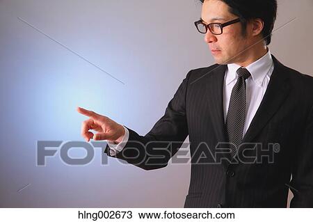 Japanese businessman using virtual reality device View Large Photo Image Stock Image - Japanese businessman using virtual reality device. Fotosearch