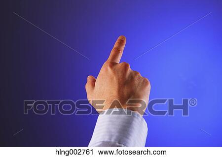 Stock Image - Japanese businessman using virtual reality device. Fotosearch