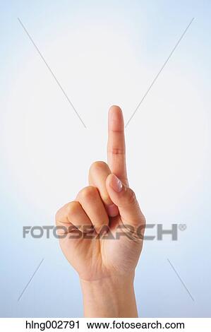 Stock Image - Japanese businessman using virtual reality device. Fotosearch