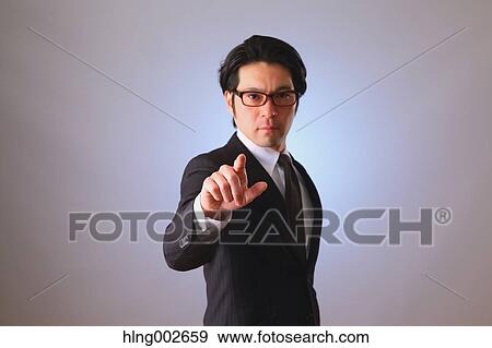Japanese businessman using virtual reality device View Large Photo Image Stock Photo - Japanese businessman using virtual reality device. Fotosearch