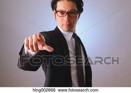 Japanese businessman using virtual reality device View Large Photo Image Stock Photo - Japanese businessman using virtual reality device. Fotosearch
