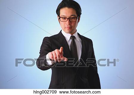 Japanese businessman using virtual reality device View Large Photo Image Stock Photo - Japanese businessman using virtual reality device. Fotosearch