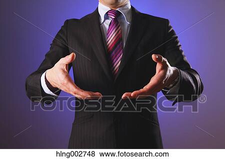Stock Photo - Japanese businessman using virtual reality device. Fotosearch