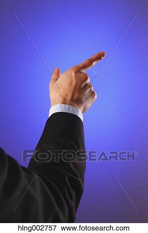 Stock Photo - Japanese businessman using virtual reality device. Fotosearch