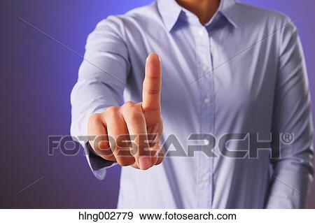 Stock Photo - Japanese businessman using virtual reality device. Fotosearch