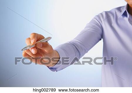 Stock Photo - Japanese businessman using virtual reality device. Fotosearch