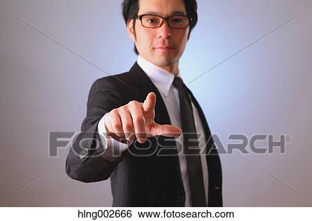 Japanese businessman using virtual reality device View Large Photo Image Stock Photograph - Japanese businessman using virtual reality device. Fotosearch