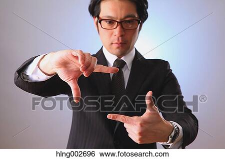 Japanese businessman using virtual reality device View Large Photo Image Stock Photograph - Japanese businessman using virtual reality device. Fotosearch