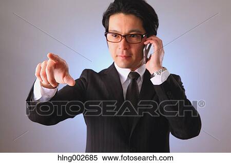 Japanese businessman using virtual reality device View Large Photo Image Stock Photography - Japanese businessman using virtual reality device. Fotosearch