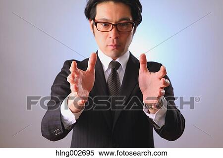 Japanese businessman using virtual reality device View Large Photo Image Stock Photography - Japanese businessman using virtual reality device. Fotosearch