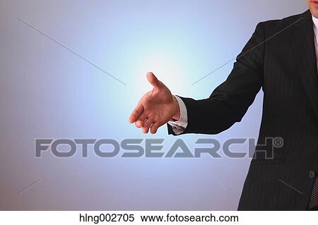 Stock Photography - Japanese businessman using virtual reality device. Fotosearch
