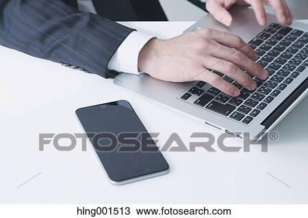 Japanese businessman working with laptop View Large Photo Image Stock Image - Japanese businessman working with laptop. Fotosearch