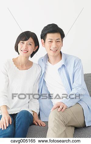 Japanese couple on the sofa View Large Photo Image Stock Photography - Japanese couple on the sofa. Fotosearch