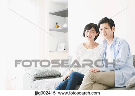 Japanese couple on the sofa View Large Photo Image Stock Photography - Japanese couple on the sofa. Fotosearch