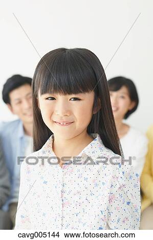 Picture - Japanese family in the living room. Fotosearch