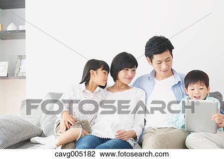 Japanese family on the sofa View Large Photo Image Stock Image - Japanese family on the sofa. Fotosearch