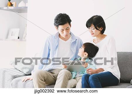 Japanese family on the sofa View Large Photo Image Stock Image - Japanese family on the sofa. Fotosearch
