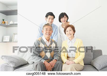 Stock Photo - Japanese family on the sofa. Fotosearch