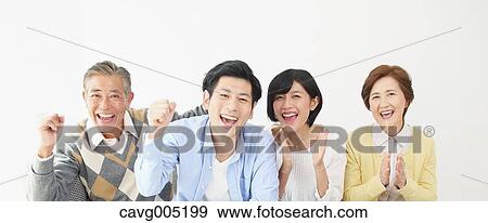 Stock Photo - Japanese family on the sofa. Fotosearch
