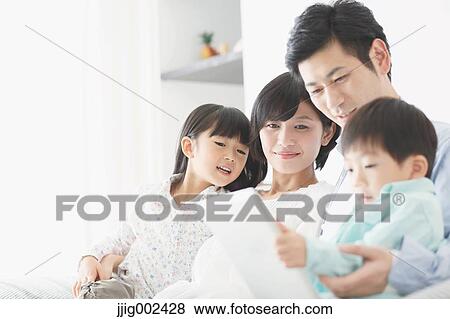Japanese family on the sofa View Large Photo Image Stock Photo - Japanese family on the sofa. Fotosearch