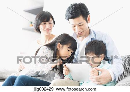 Japanese family on the sofa View Large Photo Image Stock Photo - Japanese family on the sofa. Fotosearch