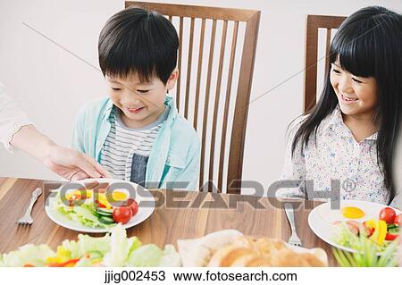 Japanese family together in the kitchen View Large Photo Image Stock Image - Japanese family together in the kitchen. Fotosearch