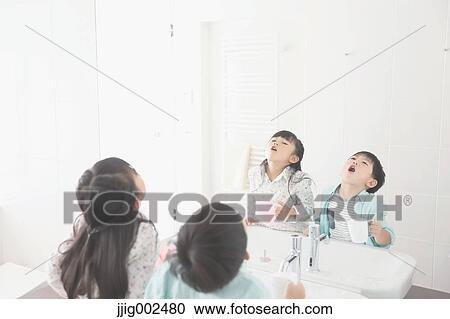Japanese kid brushing teeth in the bathroom View Large Photo Image Stock Image - Japanese kid brushing teeth in the bathroom. Fotosearch