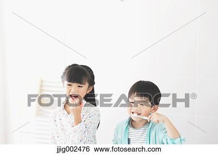 Japanese kid brushing teeth in the bathroom View Large Photo Image Stock Photograph - Japanese kid brushing teeth in the bathroom. Fotosearch