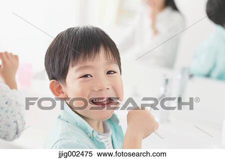 Japanese kid brushing teeth in the bathroom View Large Photo Image Stock Photography - Japanese kid brushing teeth in the bathroom. Fotosearch