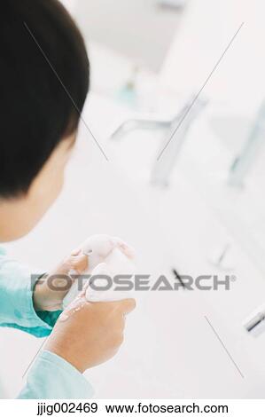 Japanese kid washing hands in the bathroom View Large Photo Image Stock Photo - Japanese kid washing hands in the bathroom. Fotosearch