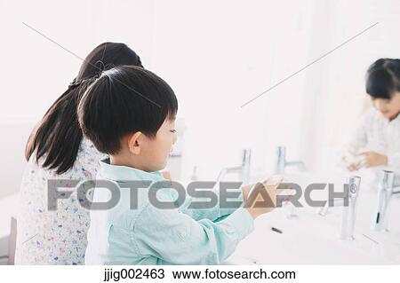 Japanese kids washing hands in the bathroom View Large Photo Image Stock Image - Japanese kids washing hands in the bathroom. Fotosearch