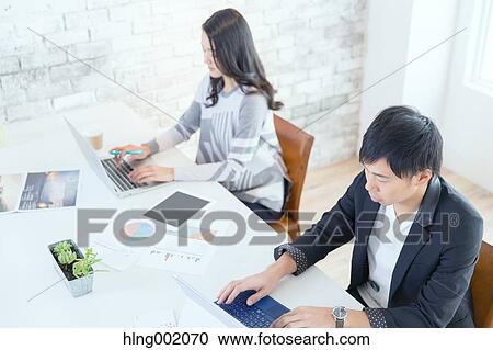 Japanese people working in modern office View Large Photo Image Stock Image - Japanese people working in modern office. Fotosearch