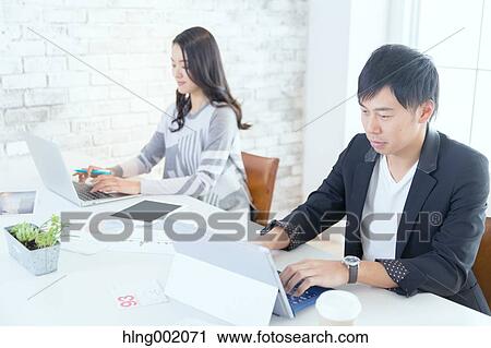 Japanese people working in modern office View Large Photo Image Stock Image - Japanese people working in modern office. Fotosearch