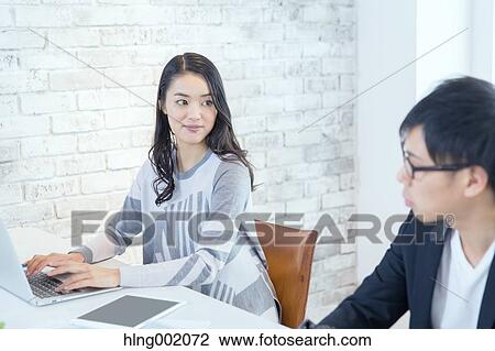 Japanese people working in modern office View Large Photo Image Stock Image - Japanese people working in modern office. Fotosearch