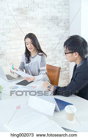Japanese people working in modern office View Large Photo Image Stock Image - Japanese people working in modern office. Fotosearch