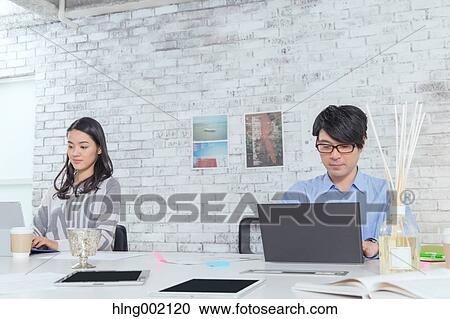 Japanese people working in modern office View Large Photo Image Stock Image - Japanese people working in modern office. Fotosearch