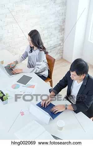 Japanese people working in modern office View Large Photo Image Stock Photo - Japanese people working in modern office. Fotosearch