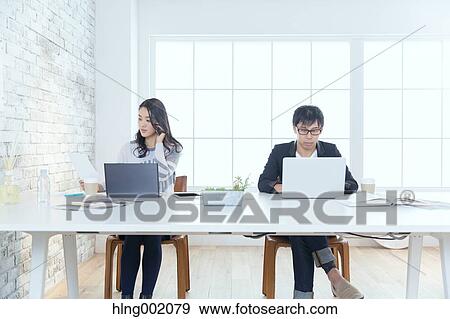 Japanese people working in modern office View Large Photo Image Stock Photo - Japanese people working in modern office. Fotosearch