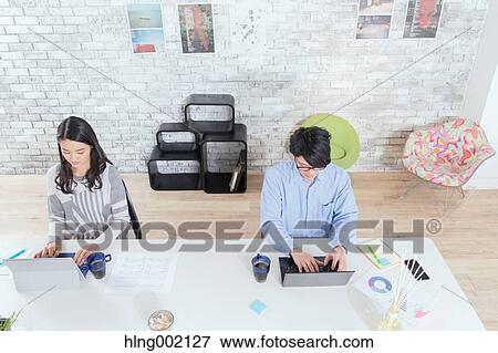 Japanese people working in modern office View Large Photo Image Stock Photo - Japanese people working in modern office. Fotosearch