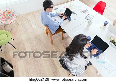 Japanese people working in modern office View Large Photo Image Stock Photograph - Japanese people working in modern office. Fotosearch