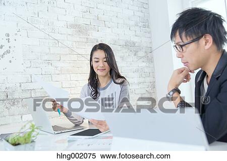 Japanese people working in modern office View Large Photo Image Stock Photography - Japanese people working in modern office. Fotosearch