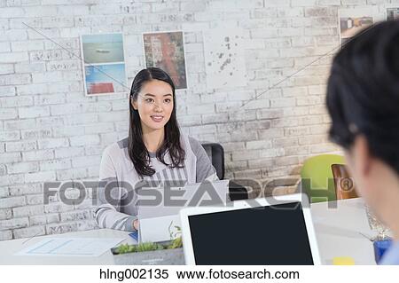 Japanese people working in modern office View Large Photo Image Stock Photography - Japanese people working in modern office. Fotosearch