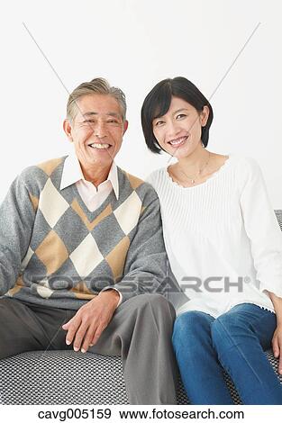 Japanese senior and daughter on the sofa View Large Photo Image Stock Photo - Japanese senior and daughter on the sofa. Fotosearch