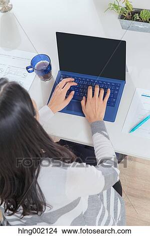 Japanese woman working in modern office View Large Photo Image Picture - Japanese woman working in modern office. Fotosearch