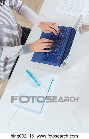 Japanese woman working in modern office View Large Photo Image Stock Photography - Japanese woman working in modern office. Fotosearch