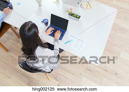 Japanese woman working in modern office View Large Photo Image Stock Photography - Japanese woman working in modern office. Fotosearch