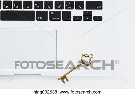 Key and laptop View Large Photo Image Stock Photo - Key and laptop. Fotosearch